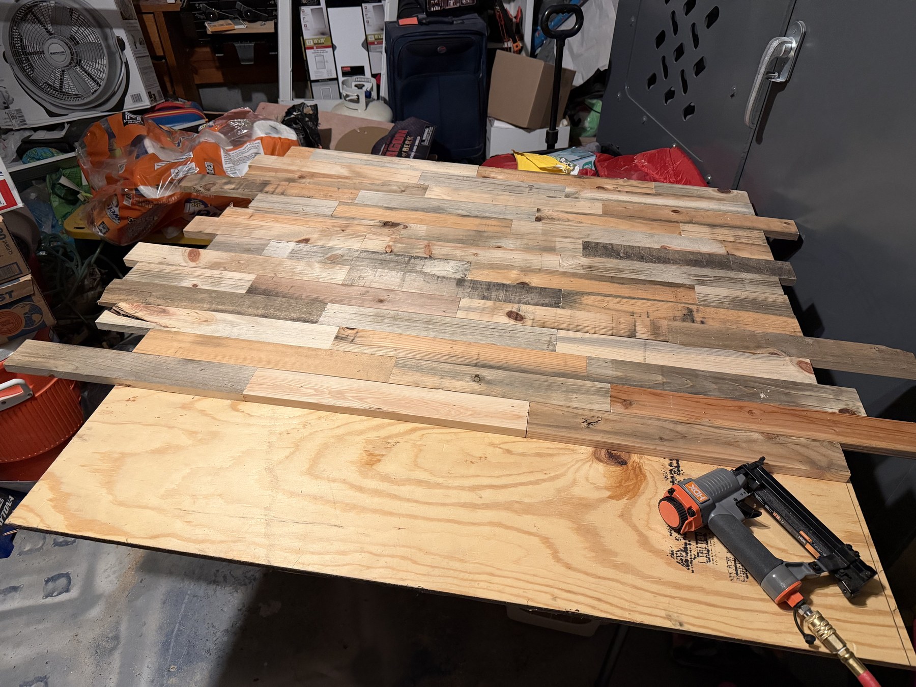 Reclaimed Wood Planks Laid Out on Workshop Bench for Color Matching